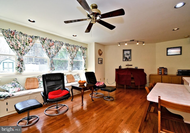 living area with track lighting, ceiling fan, recessed lighting, and wood finished floors