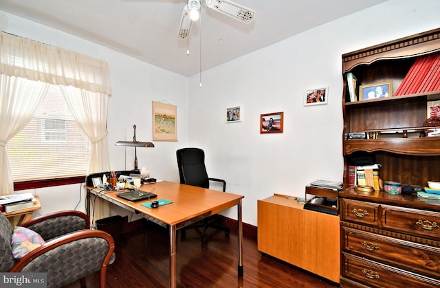 office area with baseboards, a ceiling fan, and dark wood finished floors