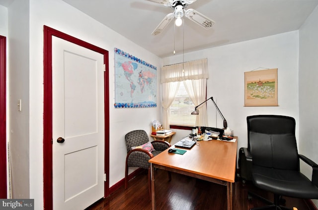 home office featuring baseboards, a ceiling fan, and dark wood-style flooring