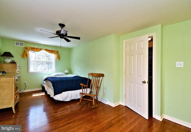 bedroom with baseboards, visible vents, ceiling fan, and dark wood-type flooring