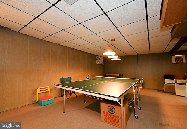 recreation room featuring carpet flooring and a drop ceiling