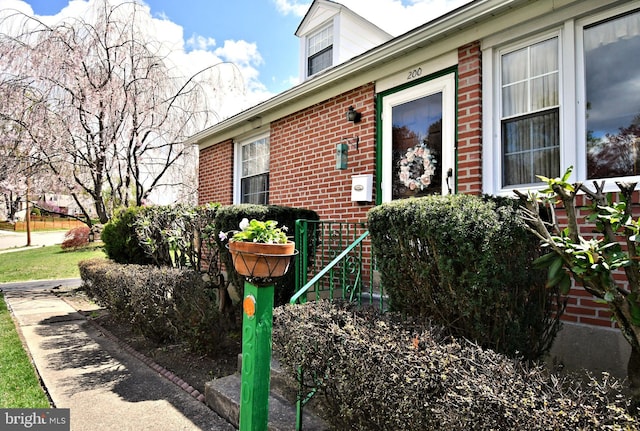 view of side of property with brick siding