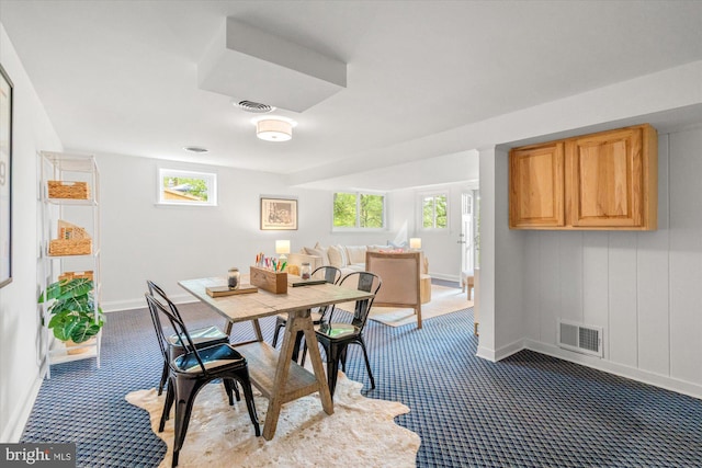 dining area with baseboards, visible vents, and a healthy amount of sunlight