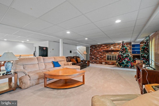 1113 Janice Ct, Joppa, MD 21085 - living room featuring stairs, brick wall, recessed lighting, a paneled ceiling, and carpet flooring