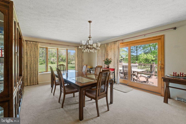 1113 Janice Ct, Joppa, MD 21085 - dining room with light colored carpet, a chandelier, and plenty of natural light
