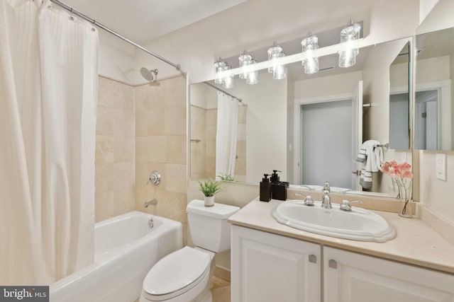 full bath with vanity, shower / bath combo, and toilet