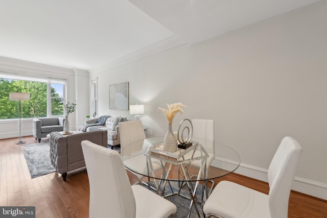 dining room with baseboards and wood finished floors