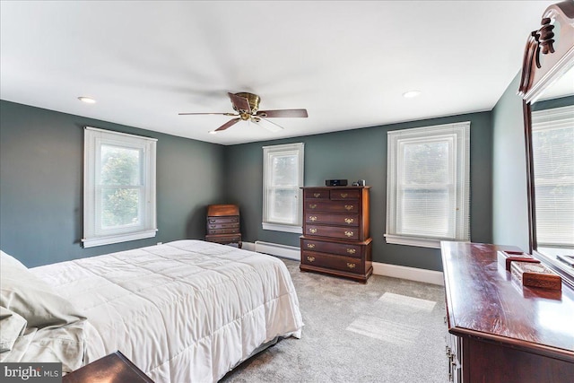 bedroom featuring a baseboard radiator, ceiling fan, baseboards, and light carpet