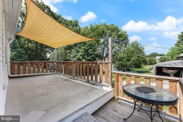 wooden deck with outdoor dining space
