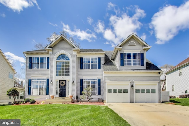 10107 Linford Ter, Lanham, MD 20706 - colonial home featuring concrete driveway, a front yard, and a shingled roof