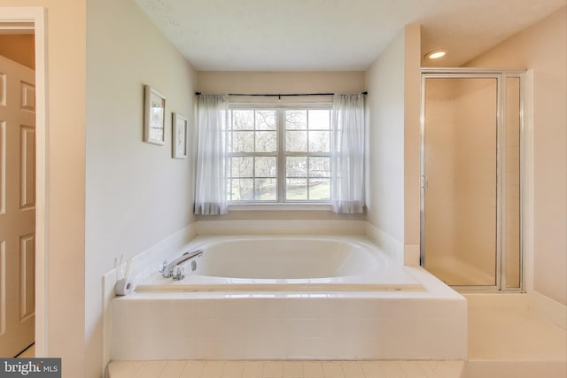 10107 Linford Ter, Lanham, MD 20706 - full bath with recessed lighting, a garden tub, and a stall shower