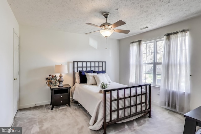 10107 Linford Ter, Lanham, MD 20706 - bedroom with ceiling fan, a textured ceiling, visible vents, carpet flooring, and baseboards