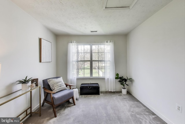 10107 Linford Ter, Lanham, MD 20706 - living area with visible vents, baseboards, a textured ceiling, attic access, and carpet flooring