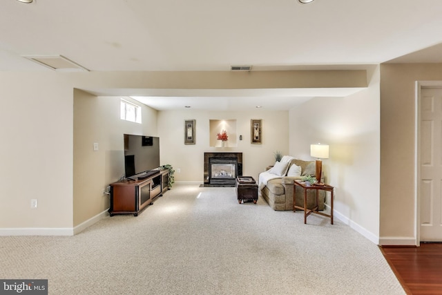 10107 Linford Ter, Lanham, MD 20706 - living area featuring carpet flooring, baseboards, a glass covered fireplace, and visible vents