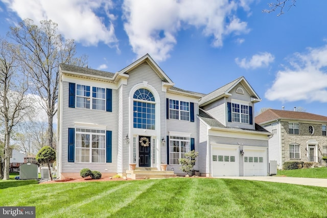 10107 Linford Ter, Lanham, MD 20706 - colonial home with central AC unit, a front lawn, an attached garage, and driveway