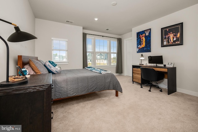 bedroom with baseboards, carpet, and visible vents