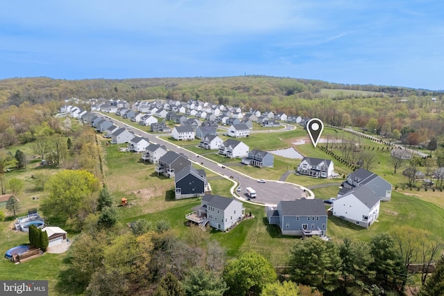 bird's eye view with a view of trees and a residential view