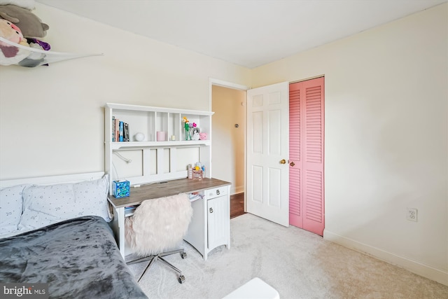 office area featuring light colored carpet and baseboards