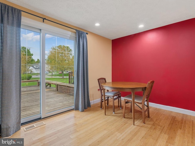 653 Willowby Run, Pasadena, MD 21122 - dining area with baseboards, wood finished floors, and visible vents