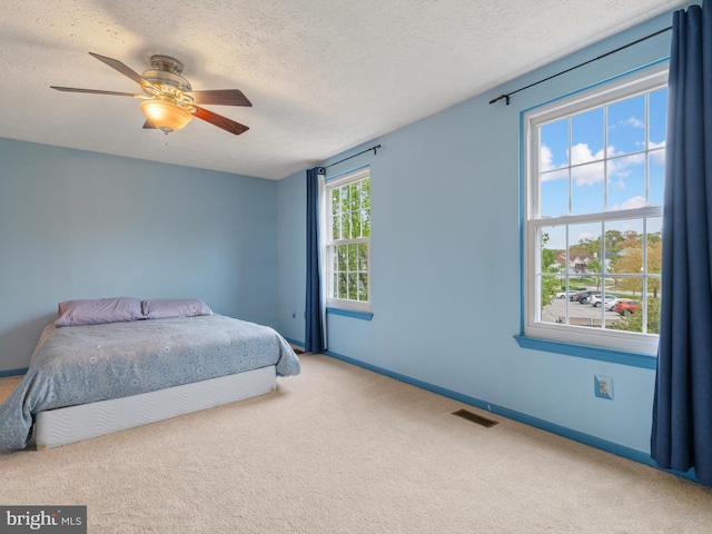 653 Willowby Run, Pasadena, MD 21122 - carpeted bedroom with baseboards, a ceiling fan, visible vents, and a textured ceiling
