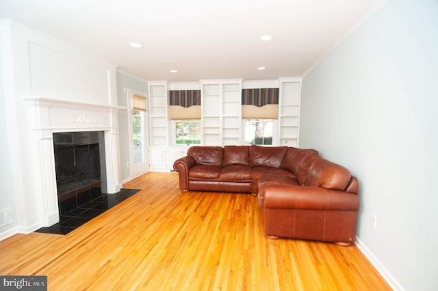 7 Briarwood Dr, Princeton Junction, NJ 08550 - living room with recessed lighting, built in features, wood finished floors, and a tile fireplace
