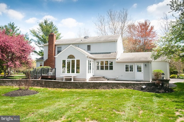 7 Briarwood Dr, Princeton Junction, NJ 08550 - rear view of property featuring a yard, a deck, a chimney, and a shingled roof