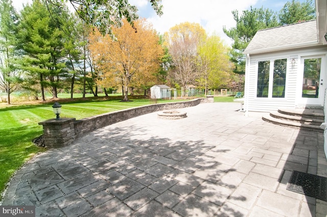 7 Briarwood Dr, Princeton Junction, NJ 08550 - view of patio with an outdoor structure, an outdoor fire pit, and a shed