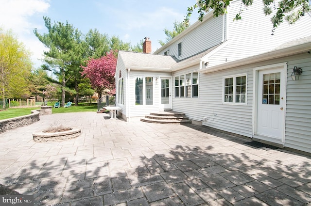 7 Briarwood Dr, Princeton Junction, NJ 08550 - rear view of property with a patio, a fire pit, and a chimney