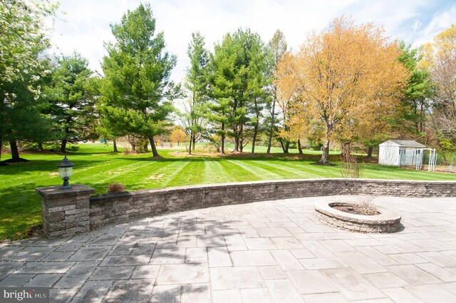 7 Briarwood Dr, Princeton Junction, NJ 08550 - view of home's community with a lawn, a patio, an outdoor structure, and an outdoor fire pit