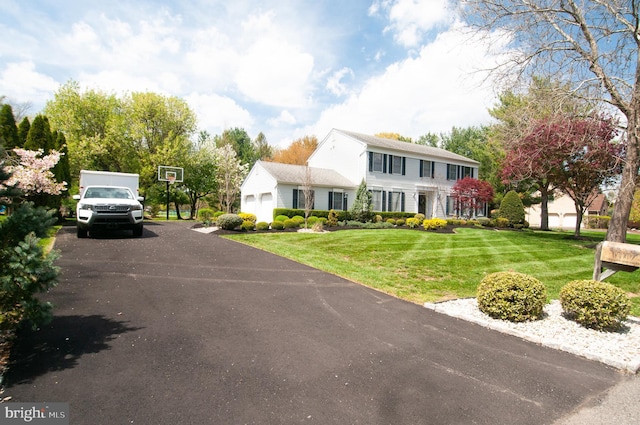 7 Briarwood Dr, Princeton Junction, NJ 08550 - colonial house featuring a garage, a front lawn, and aphalt driveway