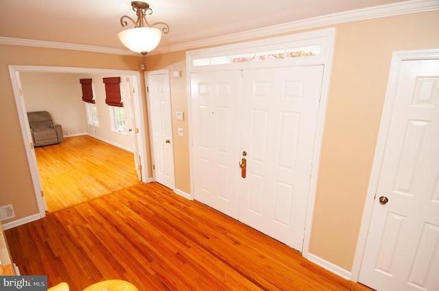 7 Briarwood Dr, Princeton Junction, NJ 08550 - foyer entrance featuring crown molding, baseboards, visible vents, and light wood-style flooring