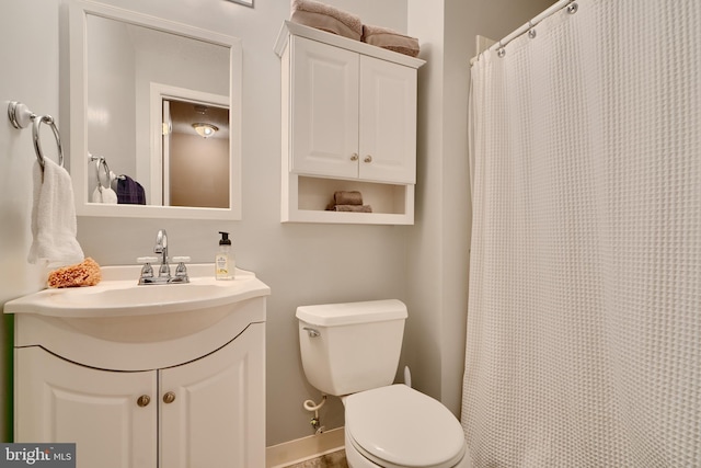 full bathroom with vanity, curtained shower, and toilet