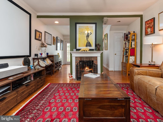 15 Morris St, Annapolis, MD 21401 - living area featuring wood finished floors, a fireplace with flush hearth, ornamental molding, baseboards, and recessed lighting