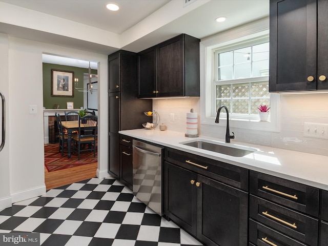15 Morris St, Annapolis, MD 21401 - kitchen featuring light floors, dishwasher, a sink, light countertops, and decorative backsplash