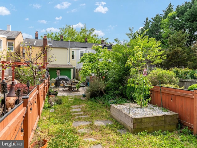 15 Morris St, Annapolis, MD 21401 - view of yard featuring a patio area, fence, and a garden