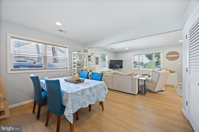 dining area with light wood-style floors, baseboards, recessed lighting, and visible vents