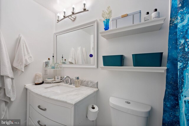bathroom with vanity and toilet