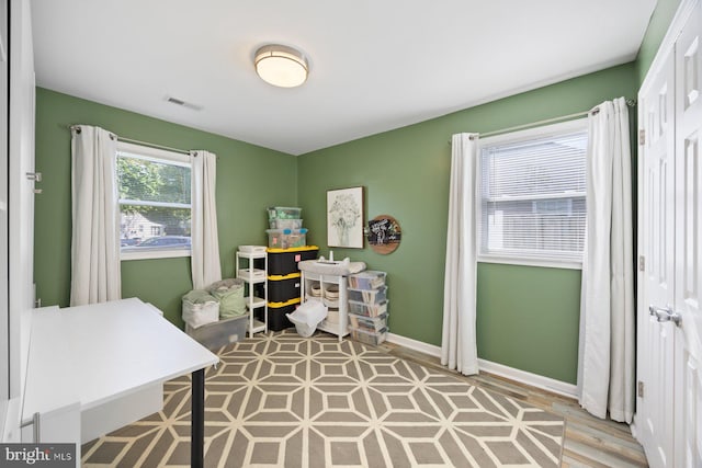 home office featuring baseboards and visible vents
