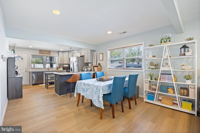 dining room featuring recessed lighting, baseboards, visible vents, and light wood-style flooring