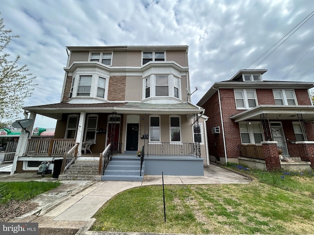 919 S Queen St, York, PA 17403 - view of front of home featuring brick siding and a porch