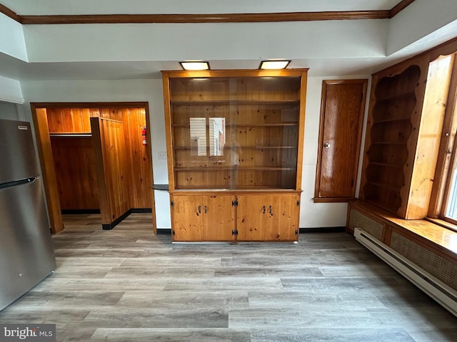 919 S Queen St, York, PA 17403 - interior space with baseboards, light wood-type flooring, a baseboard radiator, and crown molding