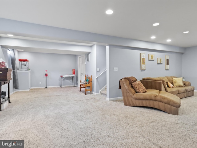 carpeted living room with baseboards, stairway, and recessed lighting