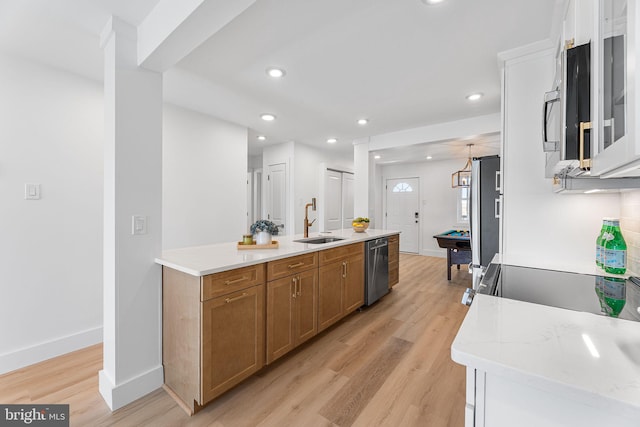 615 Salt Spray Rd Unit 3E, Ocean City, MD 21842 - kitchen featuring recessed lighting, light wood-style floors, brown cabinetry, stainless steel appliances, and a sink