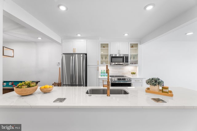 615 Salt Spray Rd Unit 3E, Ocean City, MD 21842 - kitchen featuring appliances with stainless steel finishes, a sink, white cabinetry, and recessed lighting