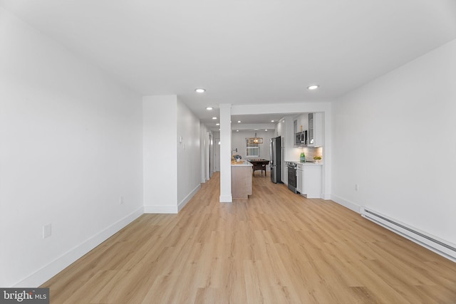 615 Salt Spray Rd Unit 3E, Ocean City, MD 21842 - unfurnished living room featuring baseboards, light wood-type flooring, recessed lighting, and baseboard heating
