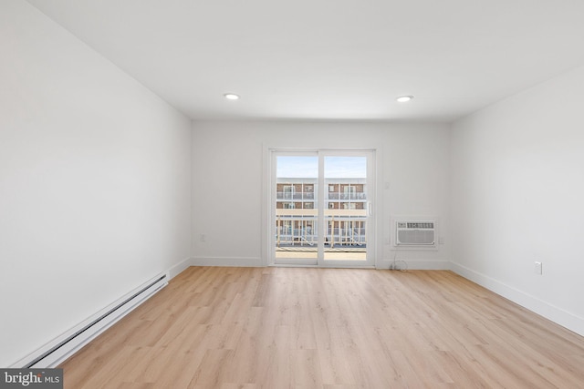 615 Salt Spray Rd Unit 3E, Ocean City, MD 21842 - unfurnished room featuring baseboard heating, baseboards, a wall mounted air conditioner, recessed lighting, and wood finished floors