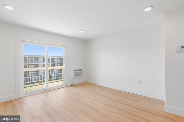 615 Salt Spray Rd Unit 3E, Ocean City, MD 21842 - spare room featuring a wall mounted AC, recessed lighting, light wood-type flooring, and baseboards
