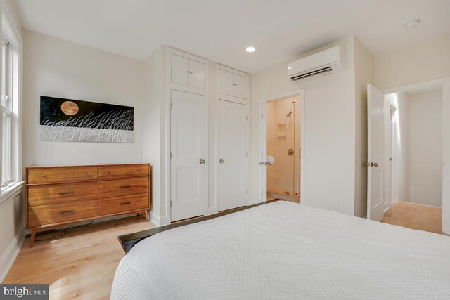 1809 12th St NW, Washington, DC 20009 - bedroom featuring a wall unit AC, light wood-type flooring, recessed lighting, and a closet