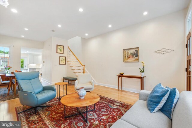 1809 12th St NW, Washington, DC 20009 - living room featuring light wood-style flooring, stairs, and recessed lighting