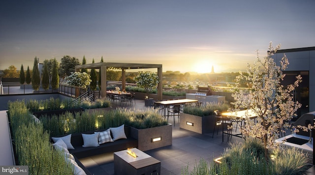 view of patio with outdoor dry bar and an outdoor living space with a fire pit